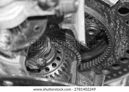 Detailed view of interlocking metal cogs and gears in a mechanical device. Industrial engineering