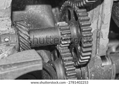Detailed view of interlocking metal cogs and gears in a mechanical device. Industrial engineering