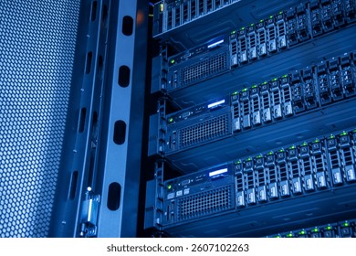 A detailed view of a modern data center server rack, showcasing multiple server units with illuminated indicators, emphasizing technology and connectivity in digital infrastructure.