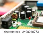 Detailed view of a modern electronic circuit board featuring capacitors, an inductor, and various components integrated for advanced technology products. For electronics projects, technology blogs