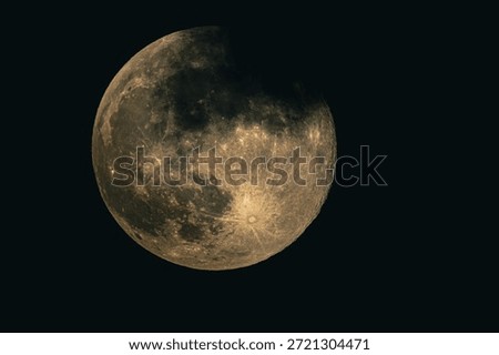 Detailed view of the Moon in partial phase against a dark night sky, showing lunar surface texture, craters, and natural light and shadow transition.