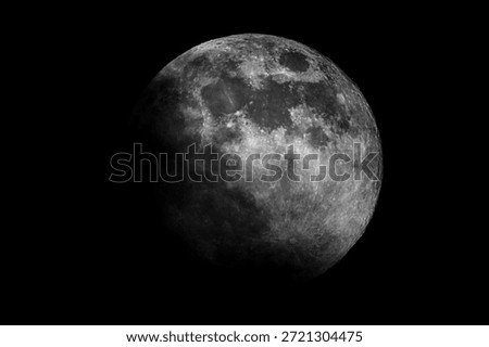 Detailed view of the Moon in partial phase against a dark night sky, showing lunar surface texture, craters, and natural light and shadow transition.