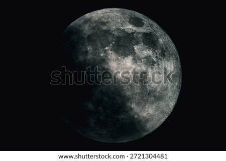 Detailed view of the Moon in partial phase against a dark night sky, showing lunar surface texture, craters, and natural light and shadow transition.