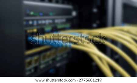 Detailed view of a network server rack with fiber optic cables, showcasing data transfer and network infrastructure. Illustrates modern technology and data centers.