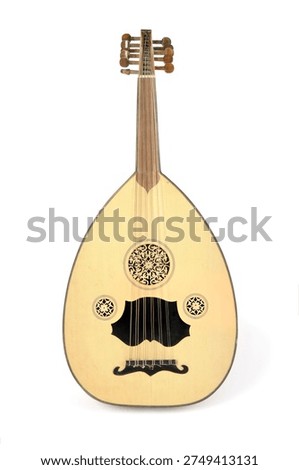 A detailed view of an oud, a pear-shaped stringed instrument, highlighting its soundhole and elegant design.