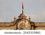 Detailed view of the Presidential Palace in Peru with the national flag flying proudly, representing Peruvian heritage.