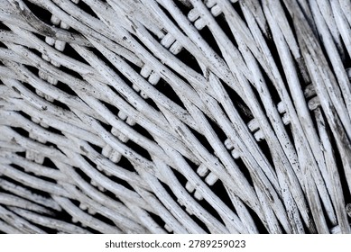 Detailed view of rustic white wickerwork pattern. Textured background of woven bamboo furniture surface.