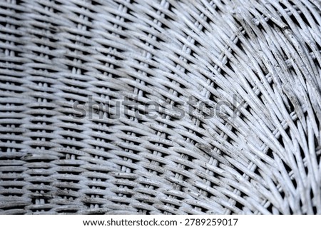 Detailed view of rustic white wickerwork pattern. Textured background of woven bamboo furniture surface.