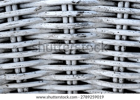 Detailed view of rustic white wickerwork pattern. Textured background of woven bamboo furniture surface.