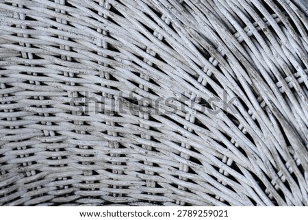 Detailed view of rustic white wickerwork pattern. Textured background of woven bamboo furniture surface.