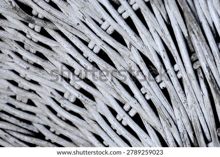 Detailed view of rustic white wickerwork pattern. Textured background of woven bamboo furniture surface.