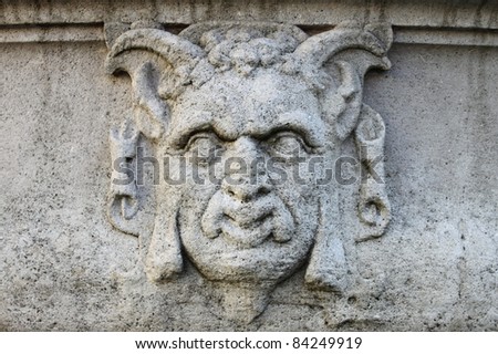 Detailed view of an satyr mask basrelief