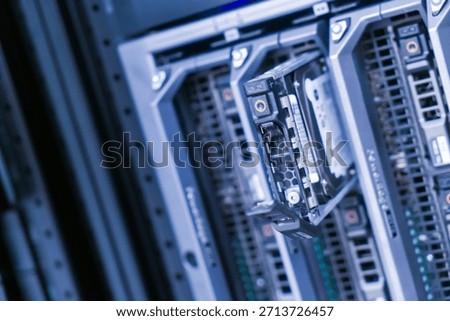 Detailed view of a server hardware component in a data center rack, showcasing the advanced technology used for data storage and network management.