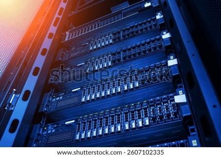 A detailed view of a server rack featuring advanced network equipment in a modern data center. The image showcases the organization and technology of server systems.