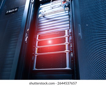 A detailed view of a server rack setup in a modern data center, showcasing organized IT equipment, efficient cooling systems, and essential network connections.