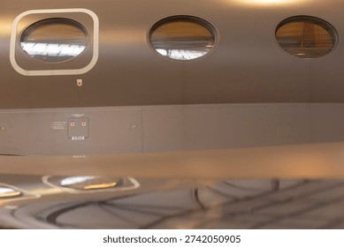 Detailed visualization of plane windows including lighting and reflections. Thorough description of aircraft window surfaces showcasing lights and mirrorlike reflections