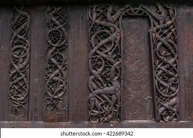 Detailed wall of the Urnes Stave Church, Norway (Deliberate slight low exposure for a darker feel to the image) - Shutterstock ID 422689342