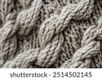 Detailed Wool Knit Sweater Texture. A close-up of a wool knit sweater highlighting the intricate weave of the patterns and the soft, inviting texture of the wool, conveying warmth and comfort.