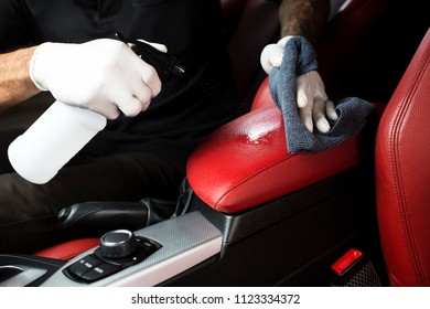 Detailing series, Cleaning red leather by use micro fiber cloth wipe chemical - Shutterstock ID 1123334372