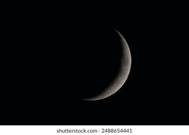 detailled new moon on dark sky; this serene and mystical image is perfect for illustrating astronomy, lunar cycles, or nighttime tranquility - Powered by Shutterstock