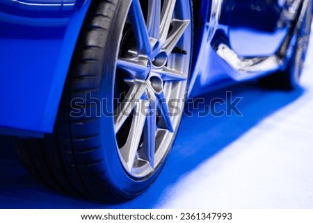 Details about the wheels of a blue super sports car, luxury car.