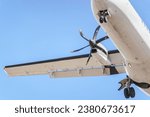 Details of an ATR 72 airplane, a twin-engine turboprop short-haul regional passenger aircraft. Landing airplane.