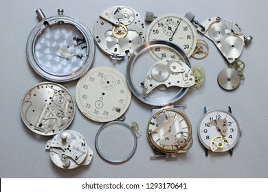 Details from the clock scattered on a metal surface.