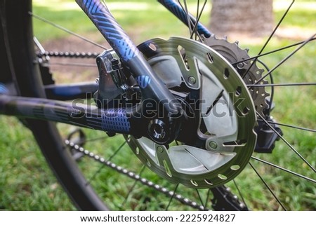 Details of the cog, spokes brake pro bike in the park in a sunny day