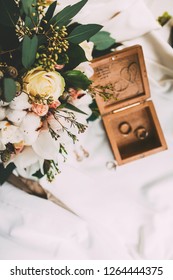 Details. Decor. On a gray textural background is white envelope for invitations, letterhead for the invitation, and nearby is a bouquet of dried flowers, tulips and purple wild flower - Shutterstock ID 1264444375