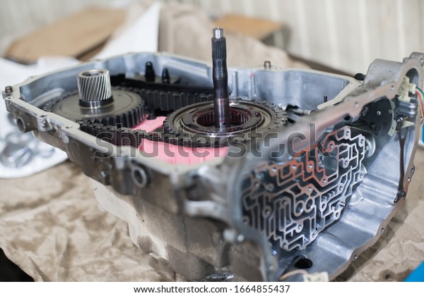 Details of a disassembled\
automatic transmission of a passenger car with a shallow depth of\
field