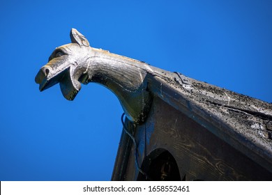 Details of dragon decoration in Heddal Stave Church. 13th century wooden, largest remaining stave church in Norway, Notodden, Telemark, Norway, Scandinavia. Sunny day, emerald blue sky, sharp shadows - Shutterstock ID 1658552461