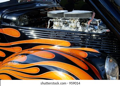 Details of the engine and graphics on a customized vehicle.