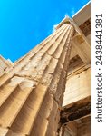 Details figures sculptures columns of the Acropolis of Athens with amazing and beautiful ruins Parthenon and blue cloudy sky in Greece