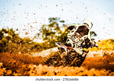 Details Of Flying Debris During An Acceleration In A Motocross Dirt Track