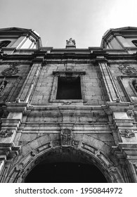 Details In The Front Entrance Of The Old Santo Domingo Church In Downtown With Two Women Walking (in Black And White)