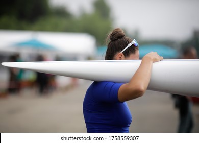 Details with the hand of a female professional rower carrying a kayak. - Powered by Shutterstock
