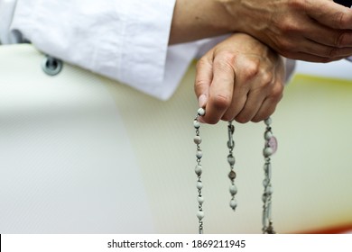 Details With The Hands Of A Catholic Nun Holding A Rosary.