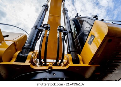Details of hydraulicheavy duty equipment vehicle on display area of dealership - Shutterstock ID 2174336109