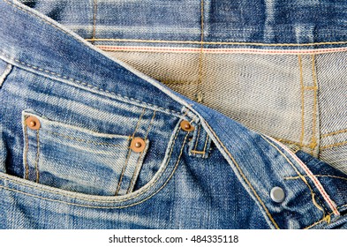 Details Of Jeans Male. The Front Waist Of The Pants With Red Seam.