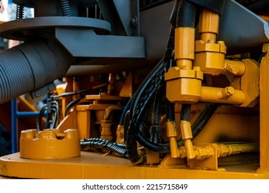 Details Of A Large Quarry Bulldozer. Exhibition Of Cars, Tractors, Dump Trucks And Other Equipment For The Mining Industry. Spare Parts Of Construction Machinery.