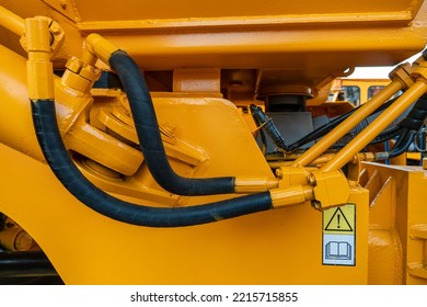 Details Of A Large Quarry Bulldozer. Exhibition Of Cars, Tractors, Dump Trucks And Other Equipment For The Mining Industry. Spare Parts Of Construction Machinery.