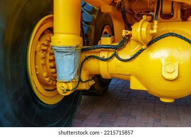 Details Of A Large Quarry Bulldozer. Exhibition Of Cars, Tractors, Dump Trucks And Other Equipment For The Mining Industry. Spare Parts Of Construction Machinery.