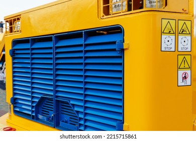 Details Of A Large Quarry Bulldozer. Exhibition Of Cars, Tractors, Dump Trucks And Other Equipment For The Mining Industry. Spare Parts Of Construction Machinery.