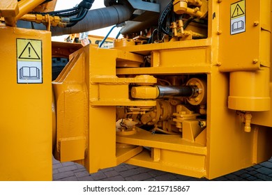 Details Of A Large Quarry Bulldozer. Exhibition Of Cars, Tractors, Dump Trucks And Other Equipment For The Mining Industry. Spare Parts Of Construction Machinery.