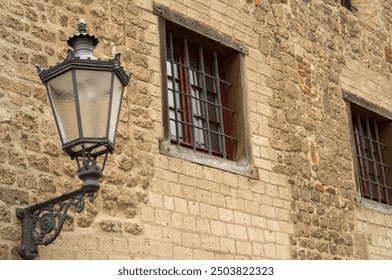 details of a medieval building, window and street lamp - Powered by Shutterstock