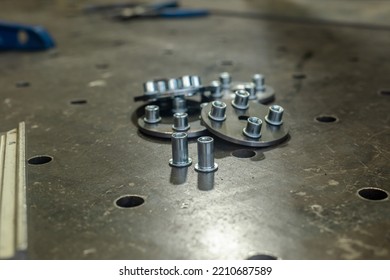 Details Of Metal Structures. Rivet Nuts In Metal. Furniture Production, Workshop.