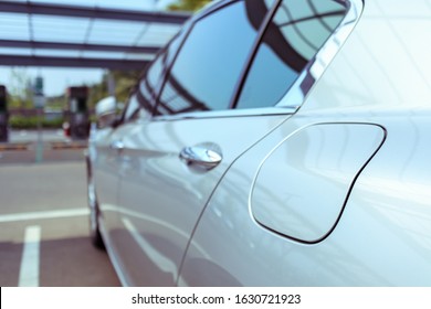 Details Of Modern Car, Small Door To Put In Gasoline, Closed Fuel Tank Door On Left Hand Side Of Car, Selective Focus