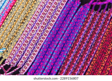 Details of multicolored handmade bracelets using alpaca fabrics and wool