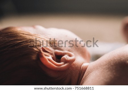 Similar – Baby sleeping on a blanket