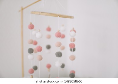 Details Of Newborn Baby Room. Toys Above The Baby Crib. Hanging Carousel Of Soft Balls For The Child.  Baby Mobile